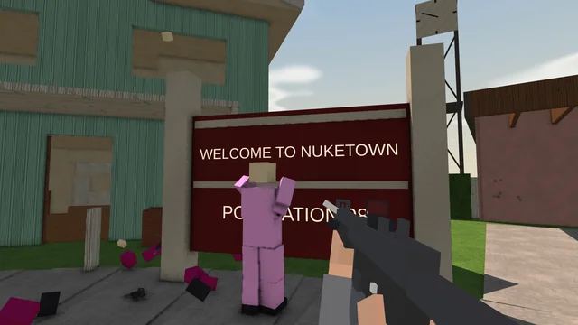 A pink bot by the Welcome to Nuketown sign in front of the green house, the player aiming an MP5. No HUD